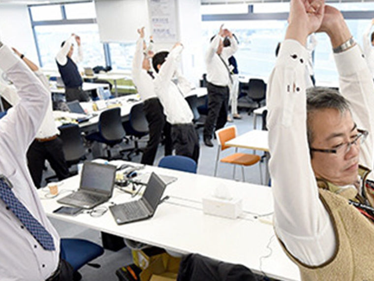 Workers stretching at their desk