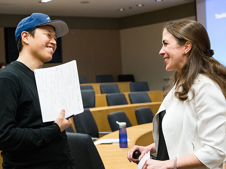 Female professor and male student having a discussion
